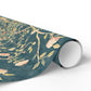 Roll of floral wrapping paper with a blue background on a white surface