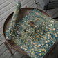 Decorative table runner with floral pattern on a wooden table