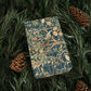Decorative box with nature-themed design on a bed of pine needles and pine cones