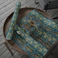 Patterned fabric with scissors on a wooden surface