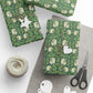 Green floral-patterned gift wrap with decorative items on a white surface
