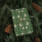 Gift box with floral pattern wrapped in greenery and pine cones