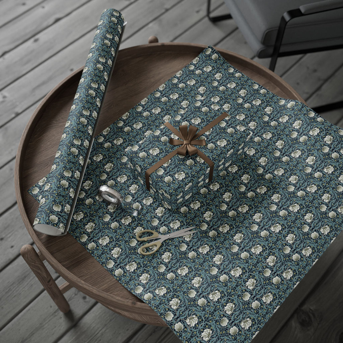 Decorative wrapping paper with floral pattern on a wooden surface