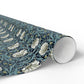 Roll of floral patterned paper on a white background