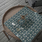 Decorative wrapping paper with floral pattern on a wooden surface