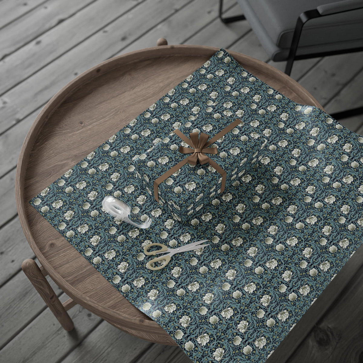Decorative wrapping paper with floral pattern on a wooden surface