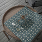 Decorative box with floral pattern on a textured surface