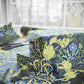 Gift boxes wrapped in floral-patterned paper with scissors on a matching surface.