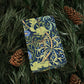 Decorative box with intricate patterns on a bed of pine needles and pine cones