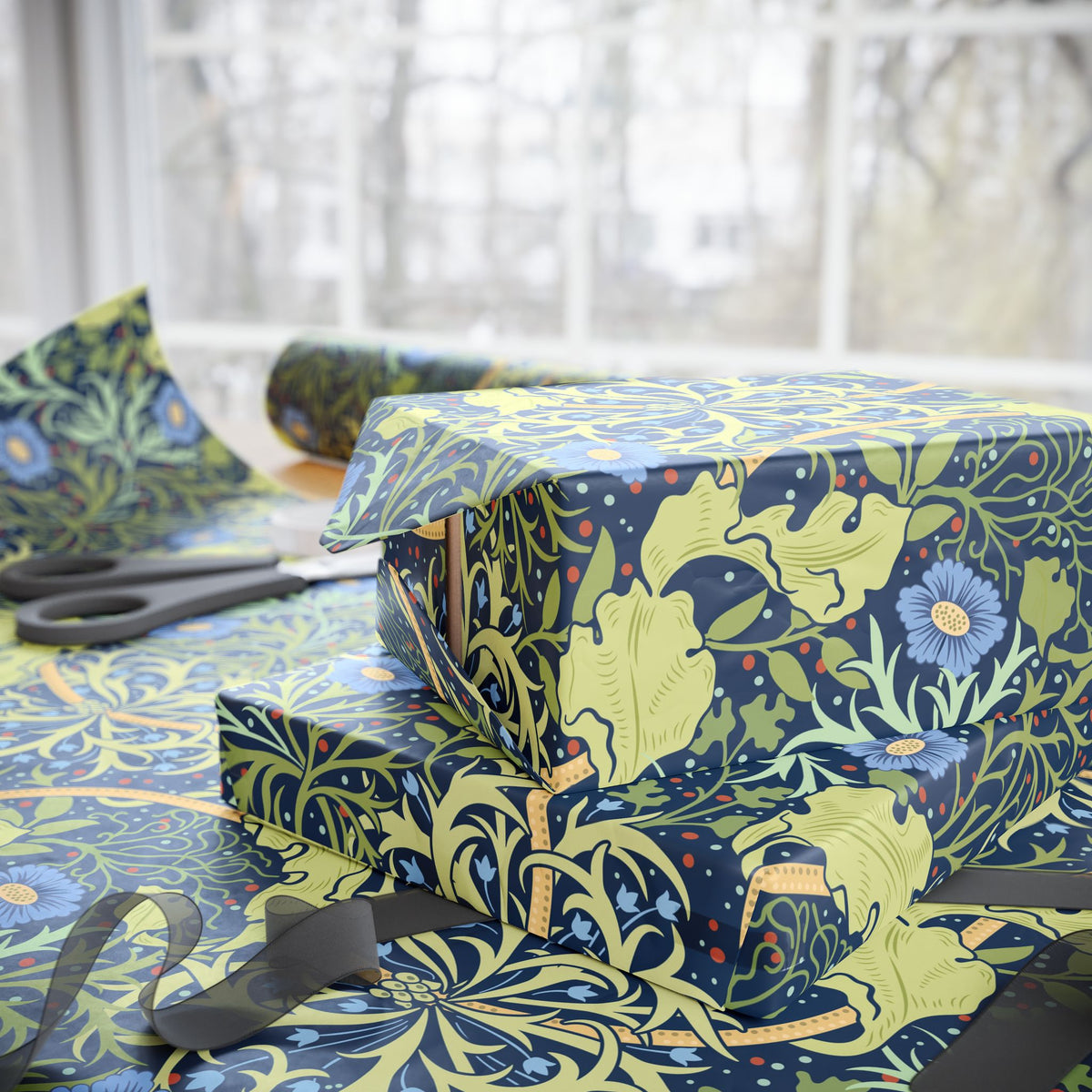 Gift boxes wrapped in floral-patterned paper with scissors on a matching surface.