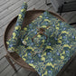 Decorative tablecloth with floral pattern on a wooden table