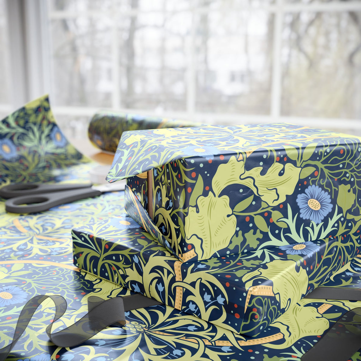 Gift box wrapped in decorative paper with scissors on a table