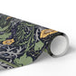 Roll of decorative paper with floral and nature-themed design on a white background