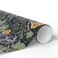 Roll of decorative paper with floral pattern on a white background