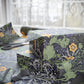 Gift boxes wrapped in floral-patterned paper with scissors on a table.
