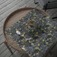 Floral-patterned wrapping paper on a wooden tray with scissors on a wooden surface