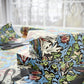 Floral-patterned fabric with scissors on a table