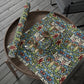 Floral-patterned wrapping paper on a wooden surface