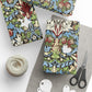 Colorful patterned fabric packages with scissors and yarn on a white background
