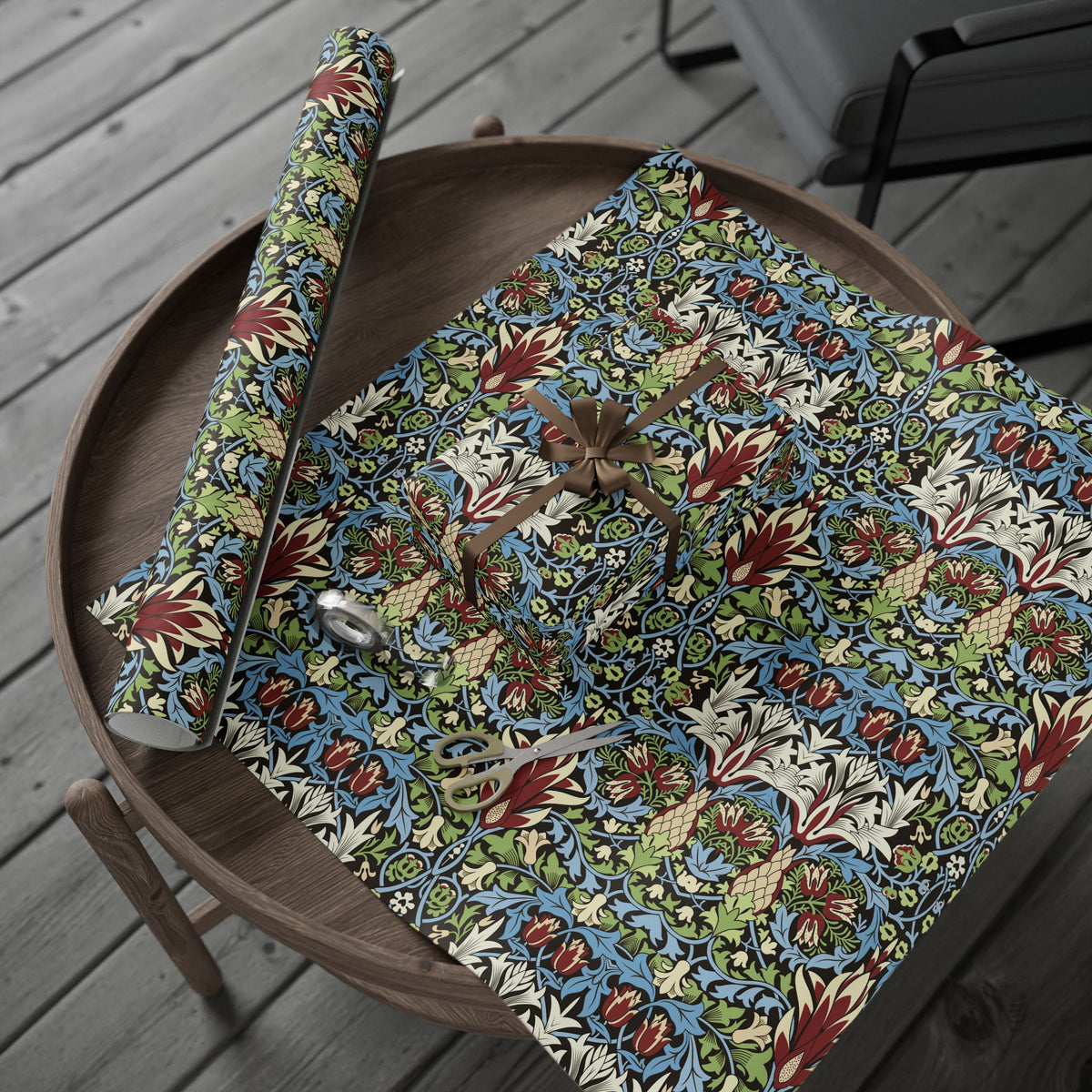 Floral-patterned wrapping paper on a wooden surface