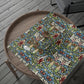 Decorative table runner with floral pattern on a wooden tray