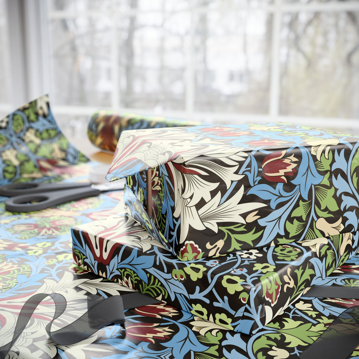 Floral-patterned wrapping paper with scissors on a table