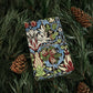 Decorative box with floral pattern on a bed of pine needles and pine cones