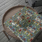Decorative wrapping paper with floral pattern on a wooden tray