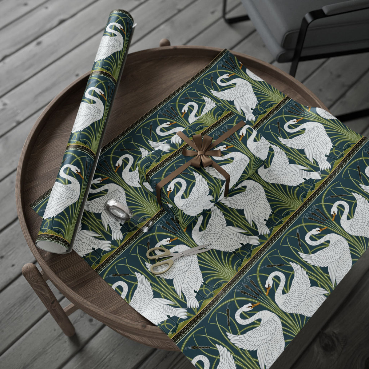 Decorative table runner with swan pattern on a wooden tray