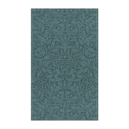 A teal kitchen tea towel with a floral and leaf pattern inspired by William Morris - Acorn and Oak Leaves Collection.