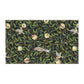 A kitchen tea towel with a design inspired by William Morris, featuring birds and pomegranate patterns on a dark background.