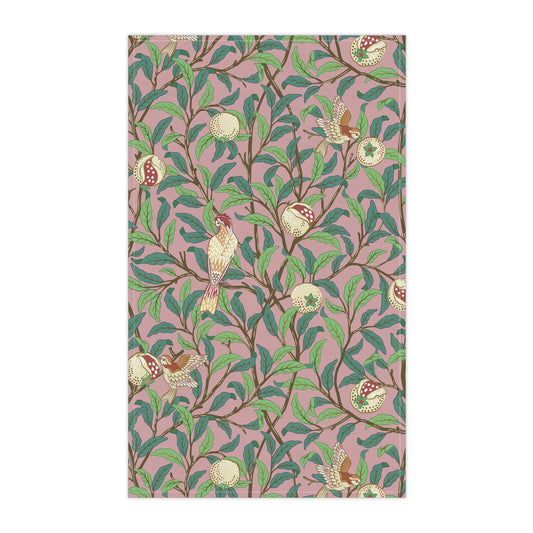 A kitchen tea towel with a floral and pomegranate design, inspired by the Art Nouveau style of William Morris.