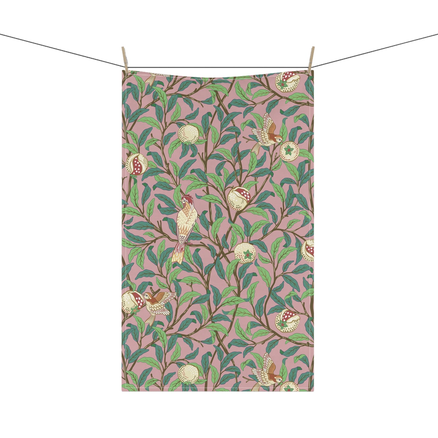 A kitchen tea towel with a floral and pomegranate design, inspired by the Art Nouveau style of William Morris.