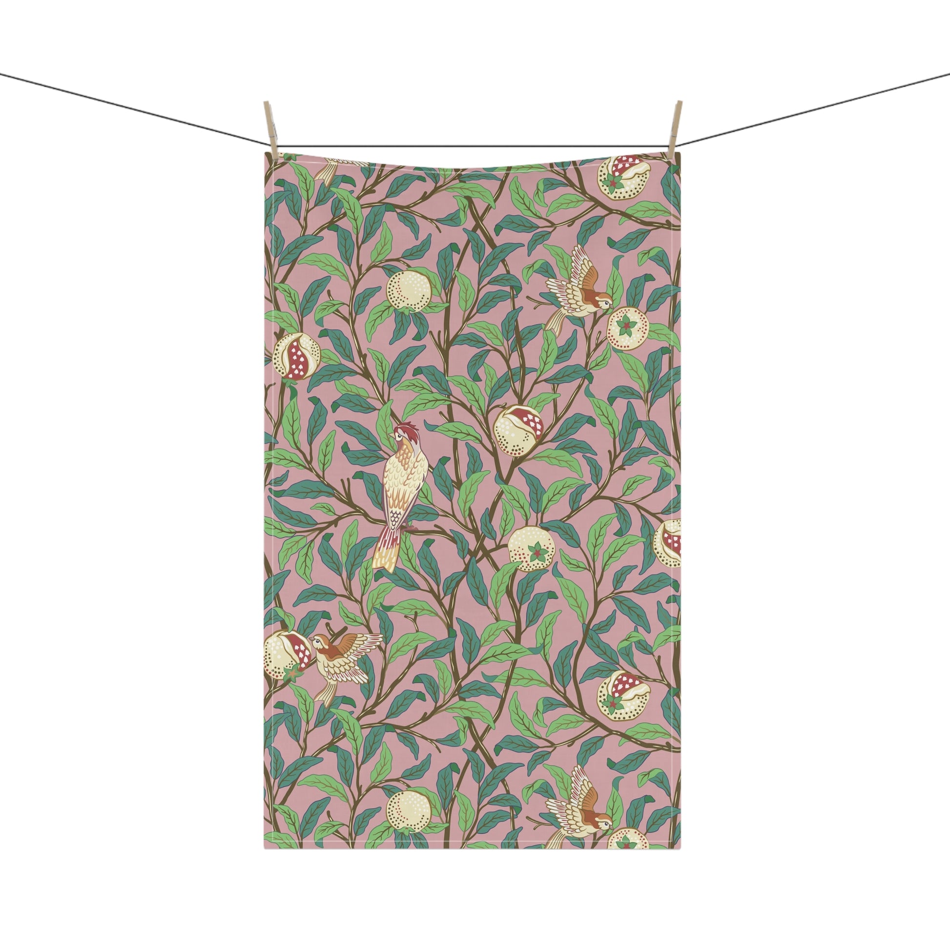 A kitchen tea towel with a floral and pomegranate design, inspired by the Art Nouveau style of William Morris.