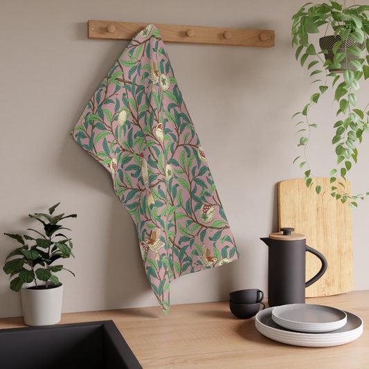 A kitchen tea towel with a floral and pomegranate design, inspired by the Art Nouveau style of William Morris.