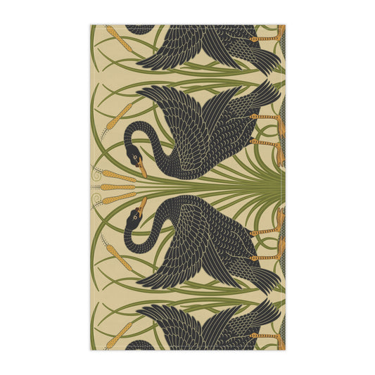 A kitchen tea towel with a repeating William Morris & Co pattern of black swans and green foliage on a beige background.