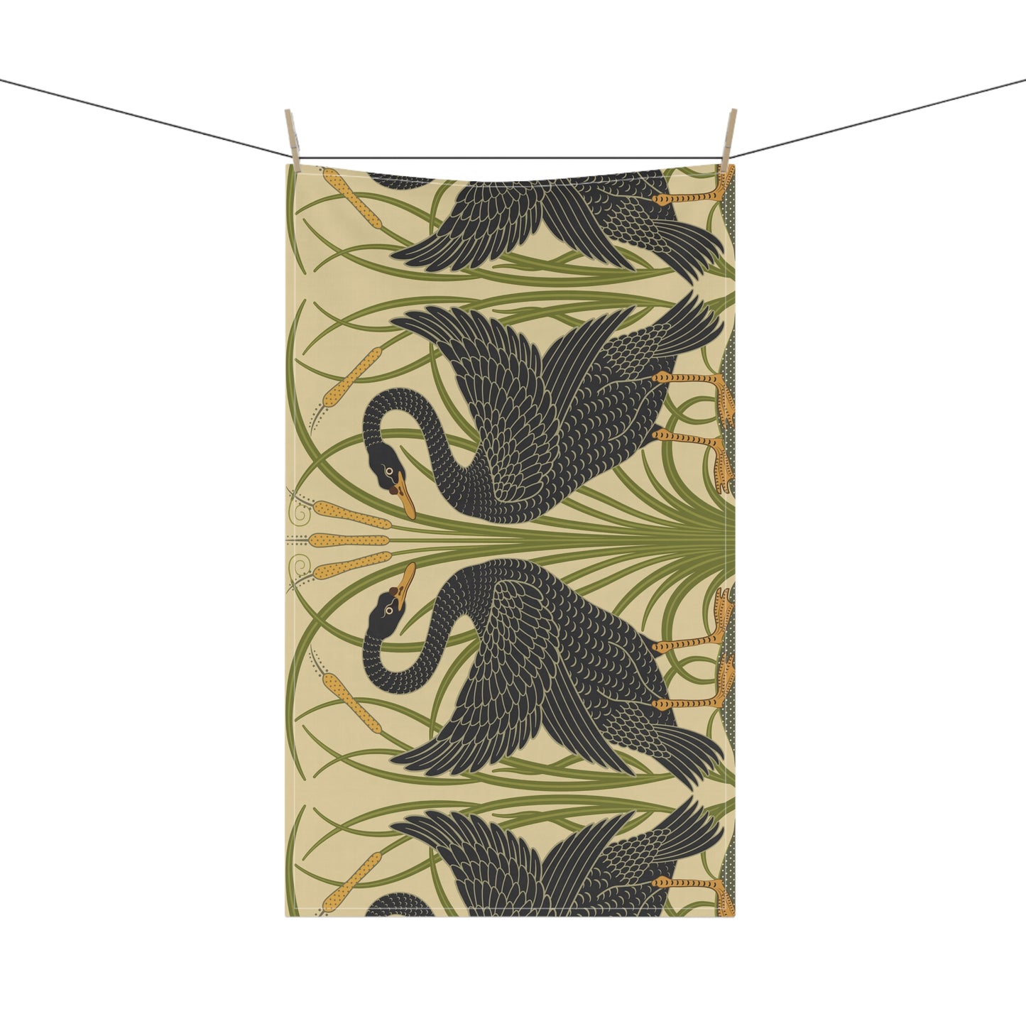 A kitchen tea towel with a repeating William Morris & Co pattern of black swans and green foliage on a beige background.