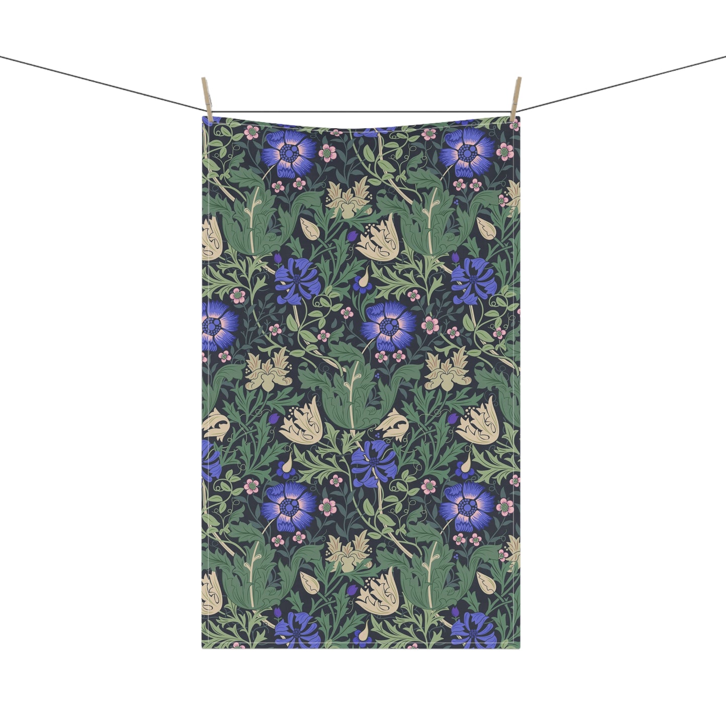 A kitchen tea towel with a floral William Morris & Co pattern featuring blue and green colours on a beige background.