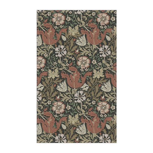 A rectangular kitchen tea towel featuring a floral pattern with brown and beige colours, inspired by William Morris & Co.