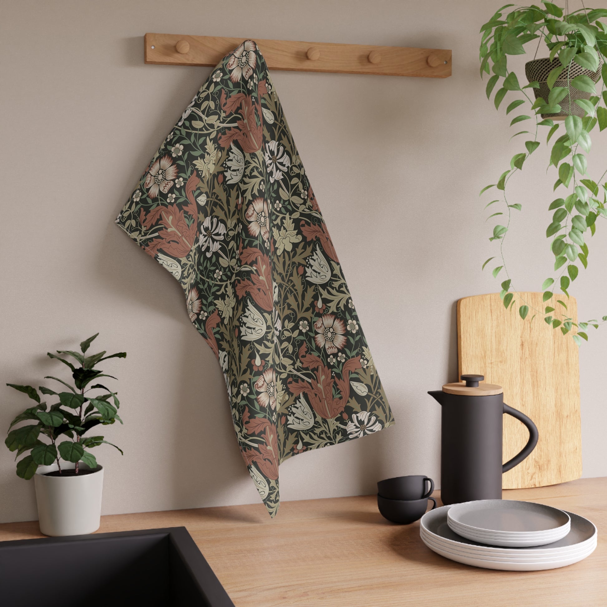 A rectangular kitchen tea towel featuring a floral pattern with brown and beige colours, inspired by William Morris & Co.
