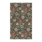 A rectangular kitchen tea towel featuring a floral pattern with brown and beige colours, inspired by William Morris & Co.