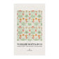 Tea towel with floral pattern and 'William Morris & Co' branding on a white background