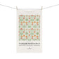 Floral patterned towel with 'William Morris & Co' branding on a white background