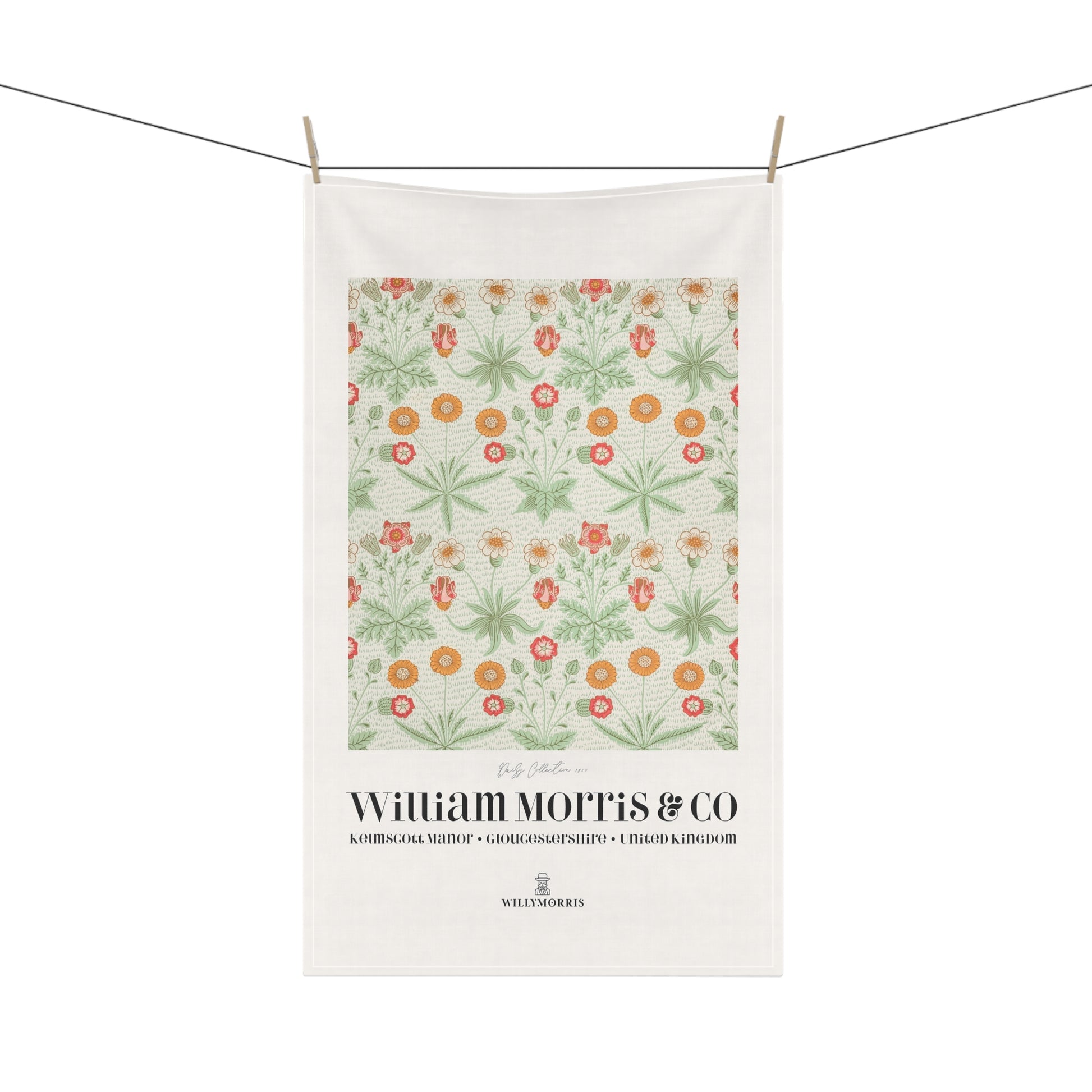 Floral patterned towel with 'William Morris & Co' branding on a white background