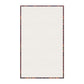 A kitchen tea towel with a floral and geometric pattern, predominantly in pink and purple colours.