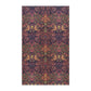 A kitchen tea towel with a floral and geometric pattern, predominantly in pink and purple colours.