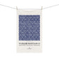 White towel with blue floral pattern and 'William Morris & Co' text on a white background