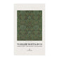Tea towel with green pattern and 'William Morris & Co' branding on a white background