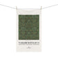 Tea towel with green pattern and 'William Morris & Co' branding on a white background