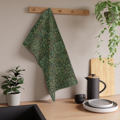 A kitchen tea towel with a floral garden pattern inspired by William Morris.